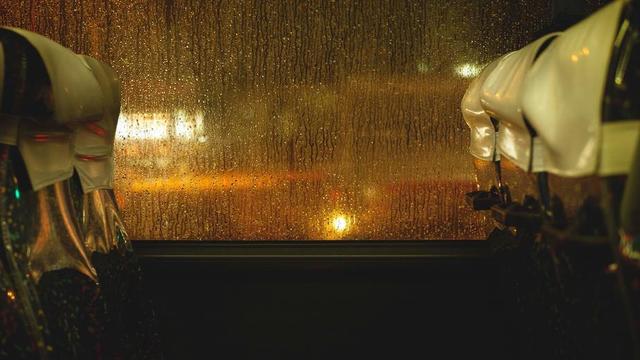rain-drops-cascading-down-bus-window.jpg
